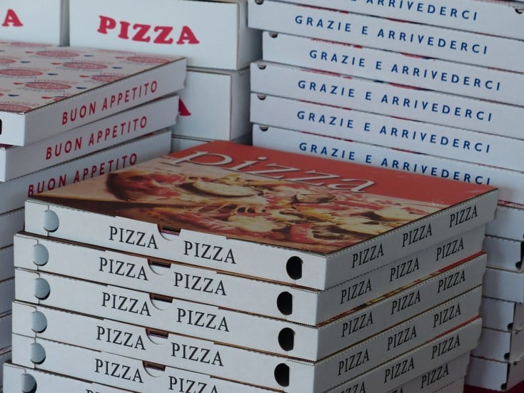 Stacked boxes of pizza