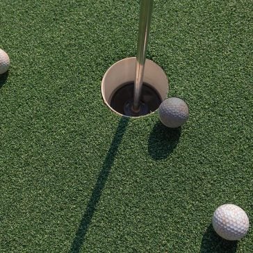 Golf hole and balls
