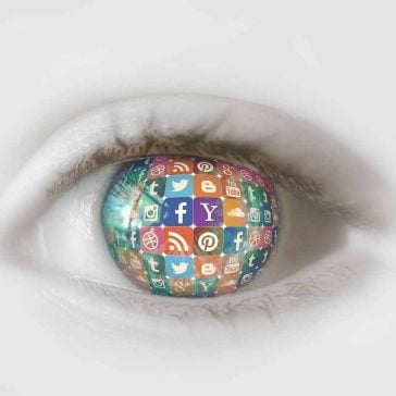 Human eye where the lens is filled with the icons of social media websites such as Yahoo, Facebook, Twitter, Instagram, Pinterest, Tumblr, Google Plus and YouTube