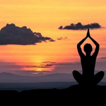 Yoga pose in sunset image to accompany partnership with Solent Mind blog