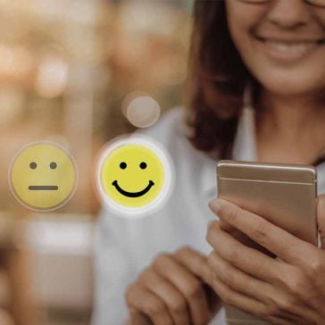 Mobile phone user showing happy face