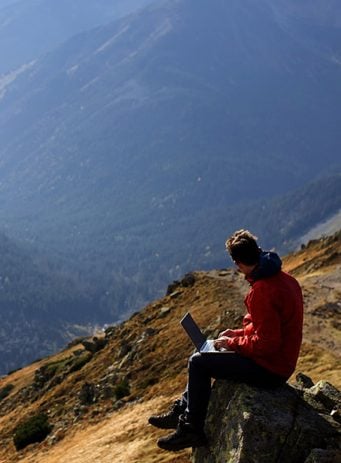 Codestone SEO and PPC case study header image showing someone using their laptop in the mountains
