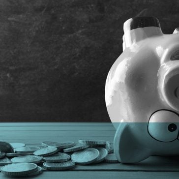 Upside down piggy bank showing wasted spemd